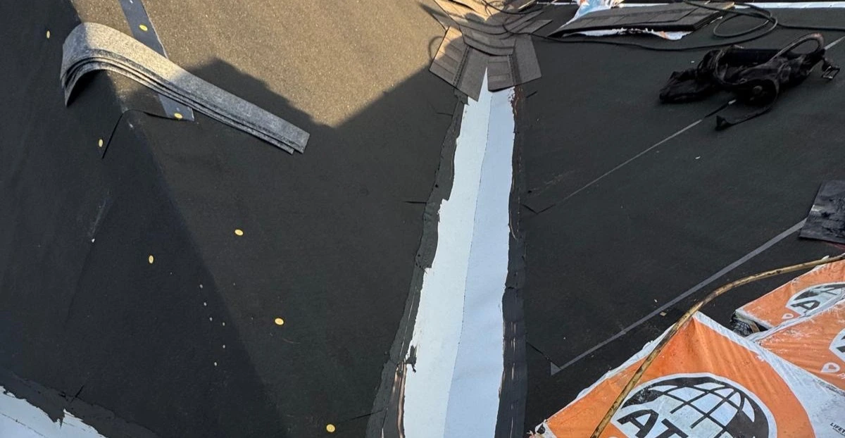 Peel and stick underlayment installation on a Tampa roof showing sealed roof deck